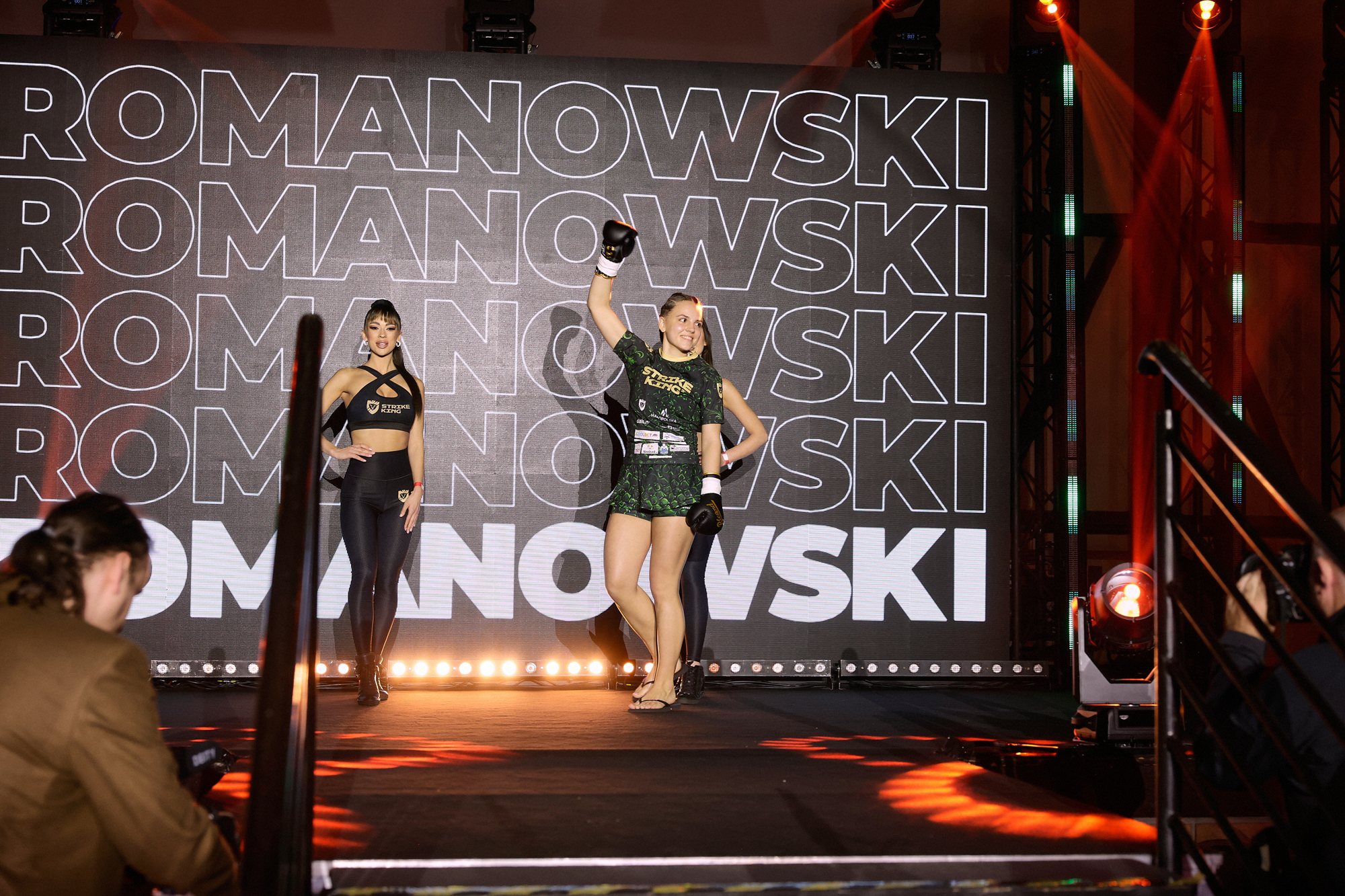 Vanessa Romanowski walking out with her name on the arena wall